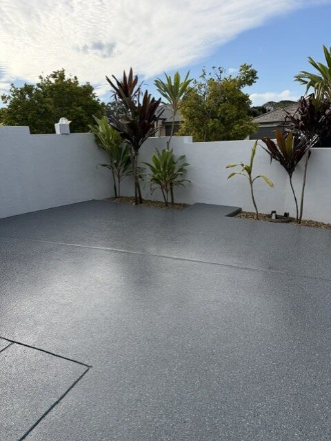 Courtyard grey flake epoxy coating by Premium Epoxy Flooring Jimboomba