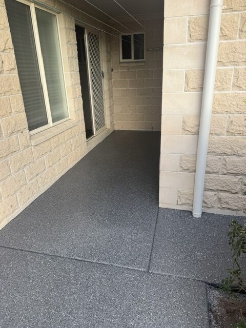 Covered patio entry dark grey flake epoxy coating by Premium Epoxy Flooring Jimboomba