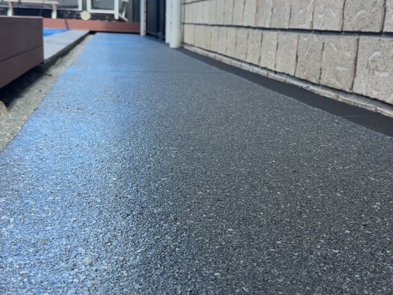 Pool surround walkway with dark flake epoxy coating — Jimboomba QLD