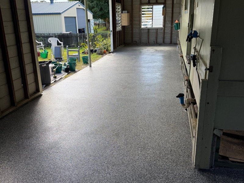 Shed workshop epoxy floor coating completed — grey flake system by Premium Epoxy Flooring